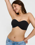 Popilush? black seamless push-up bra, ideal for shapewear dresses. Confident model in denim.